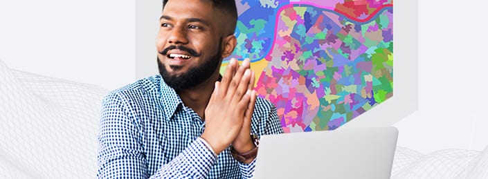Young man with button down shirt using a laptop