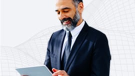 Man in business suit using a tablet