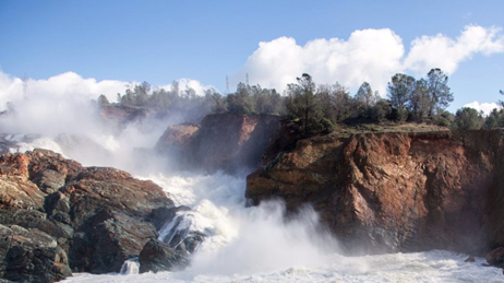 View of water flowing below the damaged spillway at Oroville Dam on Feb. 27, 2017.